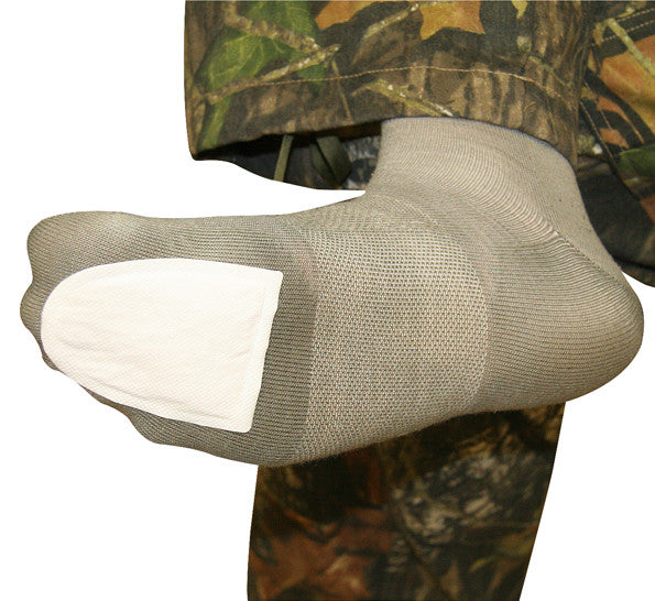 Adhesive Toewarmer applied to Sock.  Toe Warmer Big Pack offers 8 pair adhesive toe warmers that can be worn in any shoe or boot. Simply peel off adhesive backing, stick warmer to bottom of sock under toes, and enjoy 6 hours of cozy heat. Disposable Warmers, Warmers, Hot Packs, heat packs, Portable Handwarmers, Pocket Warmers, body warmers, Toewarmers,  , Adhesive toe warmers.  hot pockets, Footwarmers, adhesive warmers, feet warmers, warm packs, Heat Factory