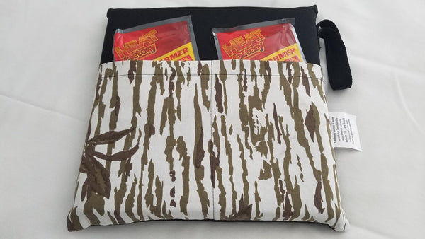 Snow Camo Heated Cushions: Heated Heat Factory cushion is great for sitting in Tree stands or use on Stadium Seats. The cushion has a water resistant bottom and a durable top with two pockets for large Heat Factory warmers.  Includes 2 Heat Factory Large Warmers.  Made in USA