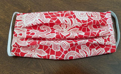 Hand sewn Print Fabric Face masks.. Soft stretch elastic loops behind ears and fits most. Washable and reusable. Package of 3 masks Made in USA